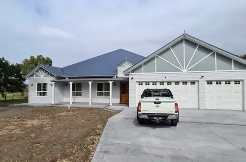 Completed weatherboard home with UPVC windows, front view