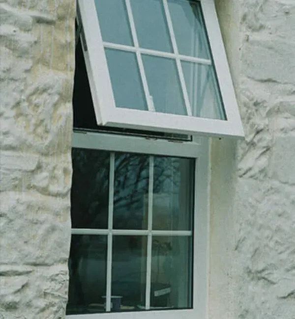 UPVC top-hung awning window on a stone cottage wall