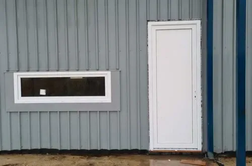 UPVC door and narrow awning window on a commercial building