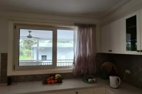 UPVC awning window above a kitchen sink, interior view